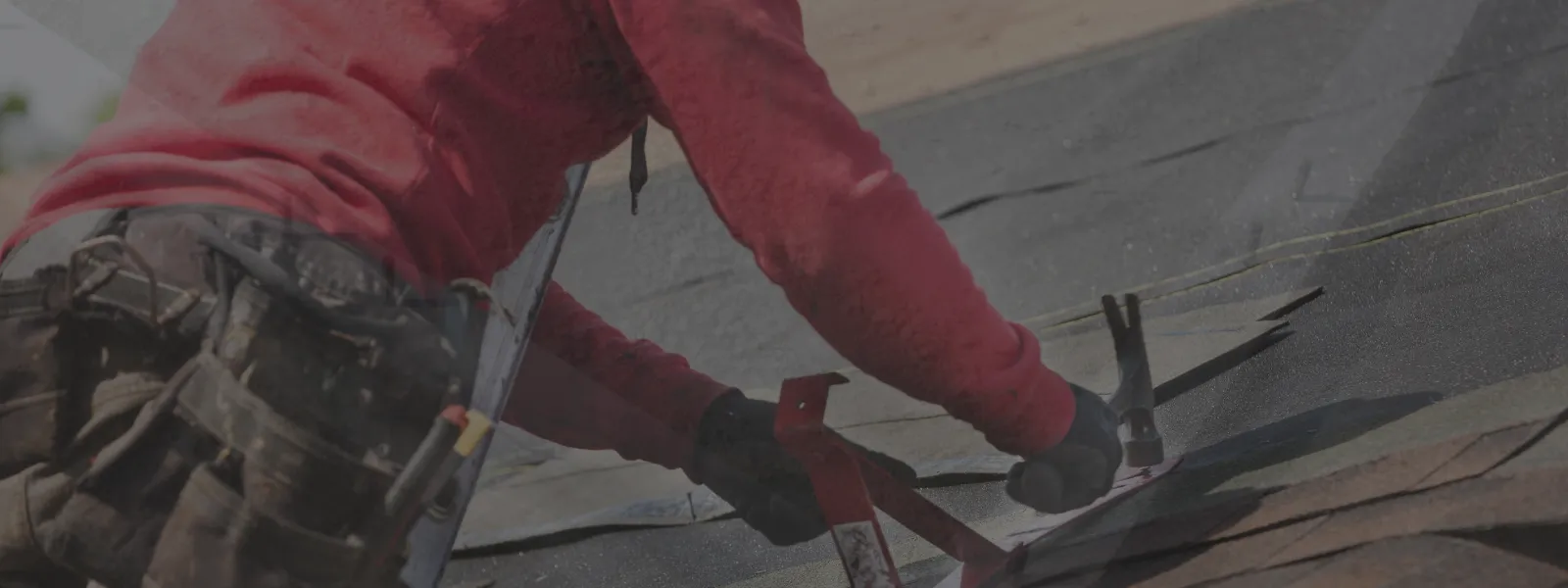 Professional roofer performing inspection